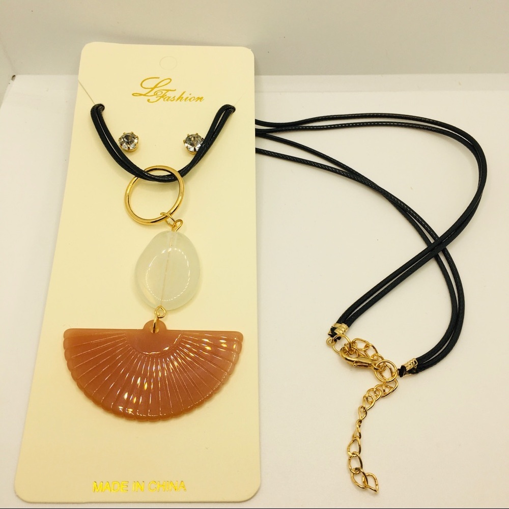 NECKLACE SHELL LIKE IN BURNT ORANGE ON CORD!